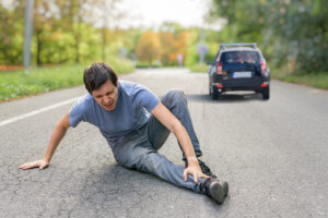 Hit,And,Run,Concept.,Injured,Man,On,Road,In,Front